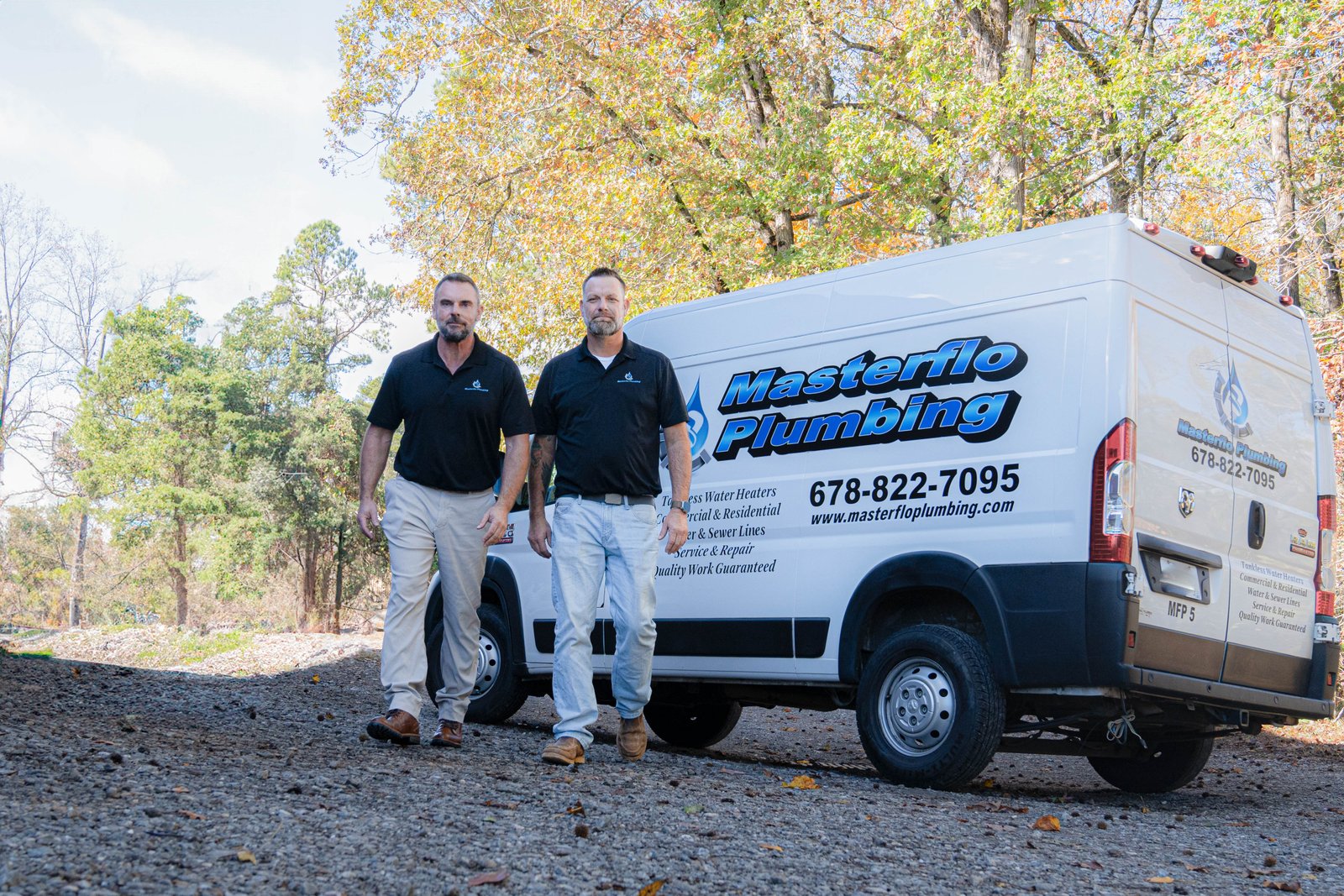 MasterFlo Plumbing owners Mike Roberts and Shane Weldy with the company service van